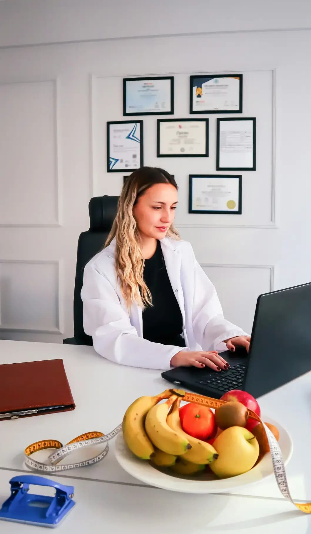Doctor reviewing patient feedback on a laptop